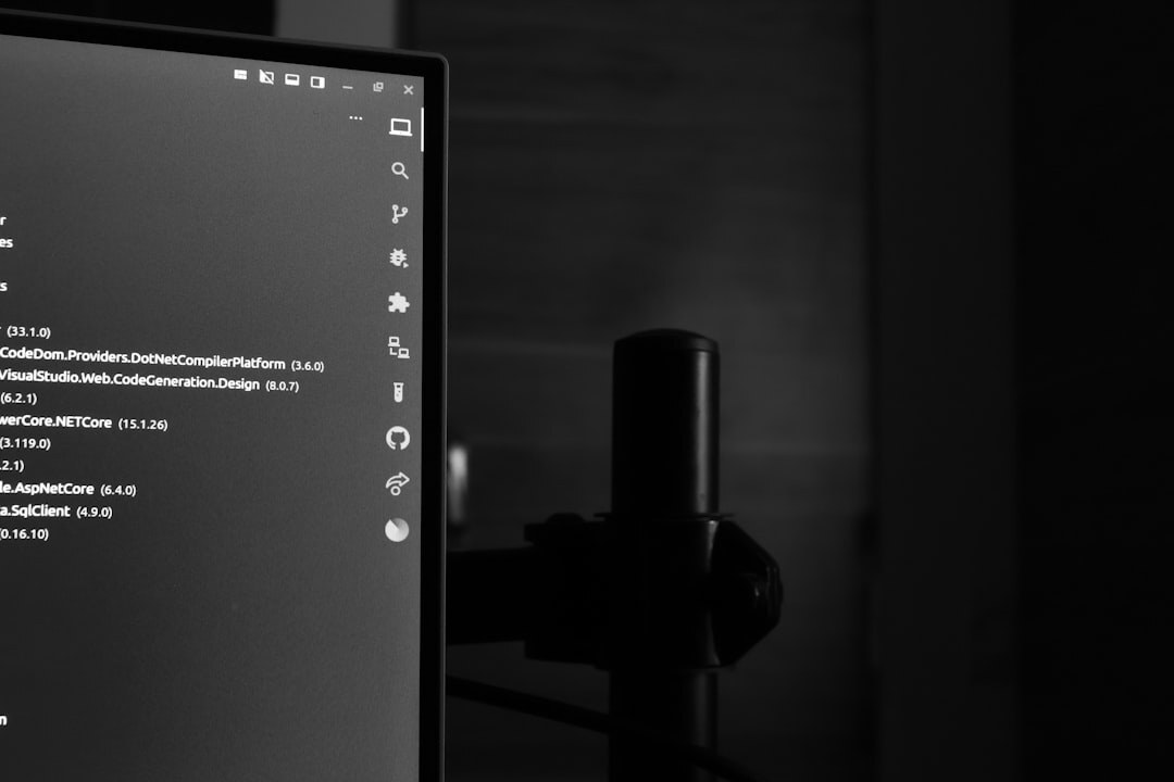 Code on computer monitor in dark room