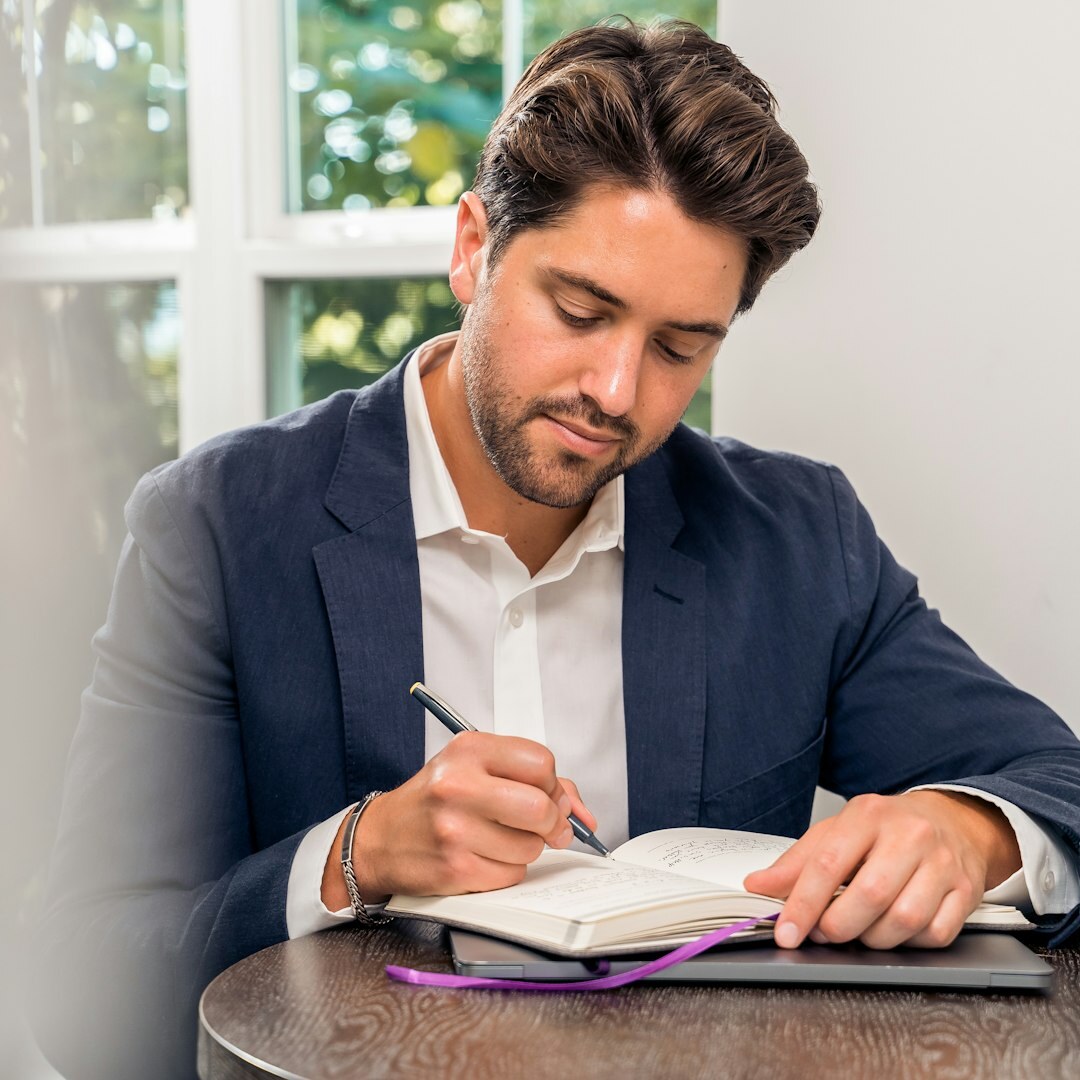 Professional Belgian man in business attire with glasses